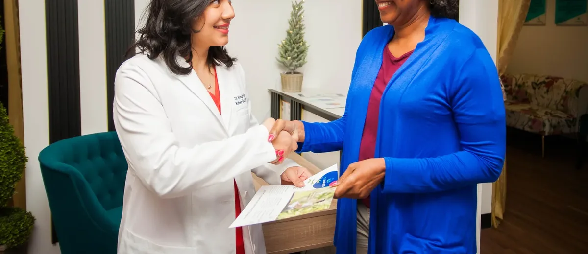 Dr. Bismah Irfan greeting a patient at the Houston clinic